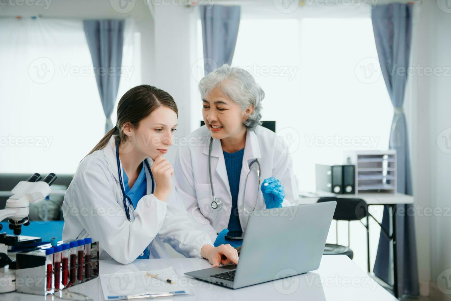 Hospital Ward. Doctor Talks With Professional Head Nurse or Surgeon, They Use Digital tablet Computer. Diverse Team of Health Care Specialists Discussing Test Result photo