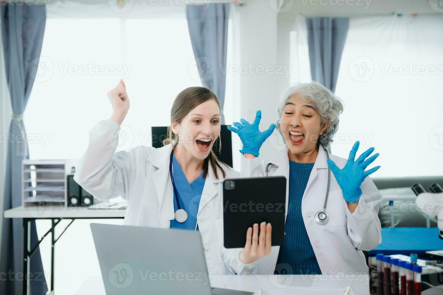 Hospital Ward. Doctor Talks With Professional Head Nurse or Surgeon, They Use Digital tablet Computer. Diverse Team of Health Care Specialists Discussing Test Result photo