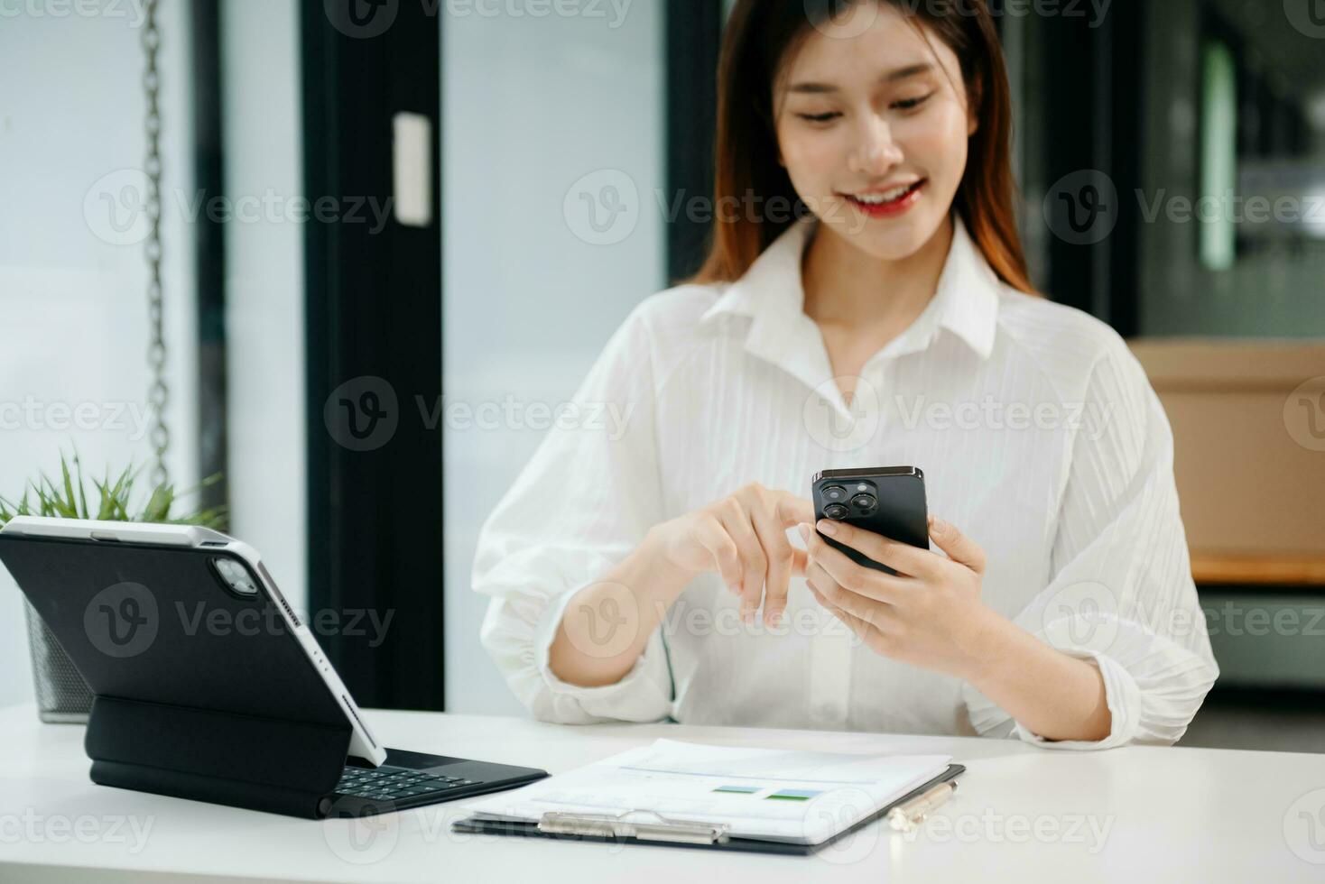 Woman hand using laptop, tablet and smartphone in office. Digital marketing media mobile app and discussing plan new start up project. Finance task. photo