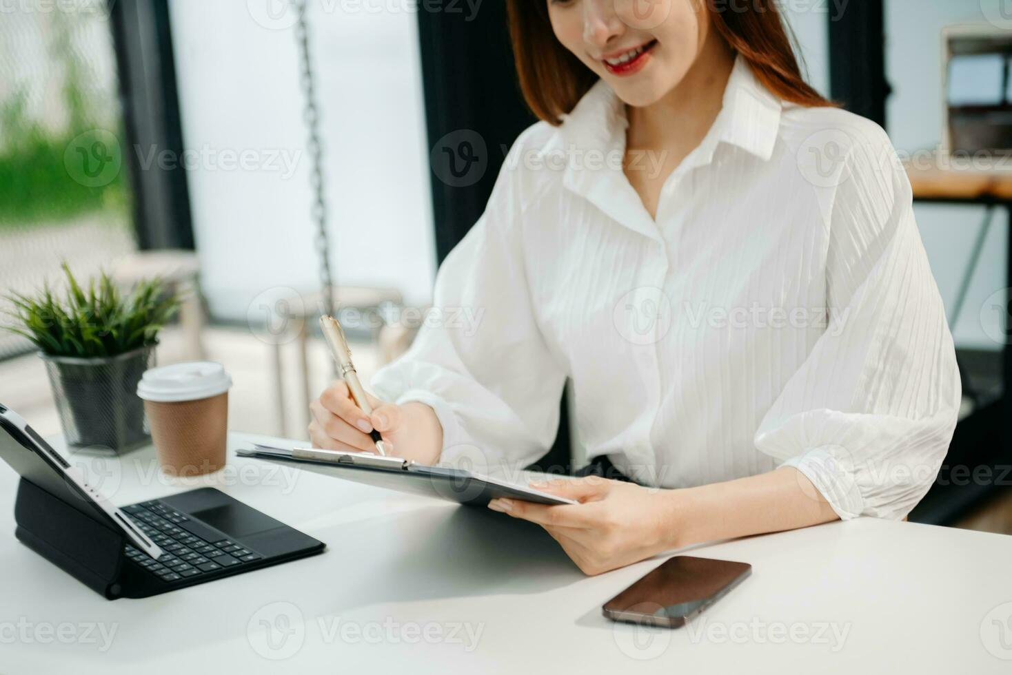 Woman hand using laptop, tablet and smartphone in office. Digital marketing media mobile app and discussing plan new start up project. Finance task. photo