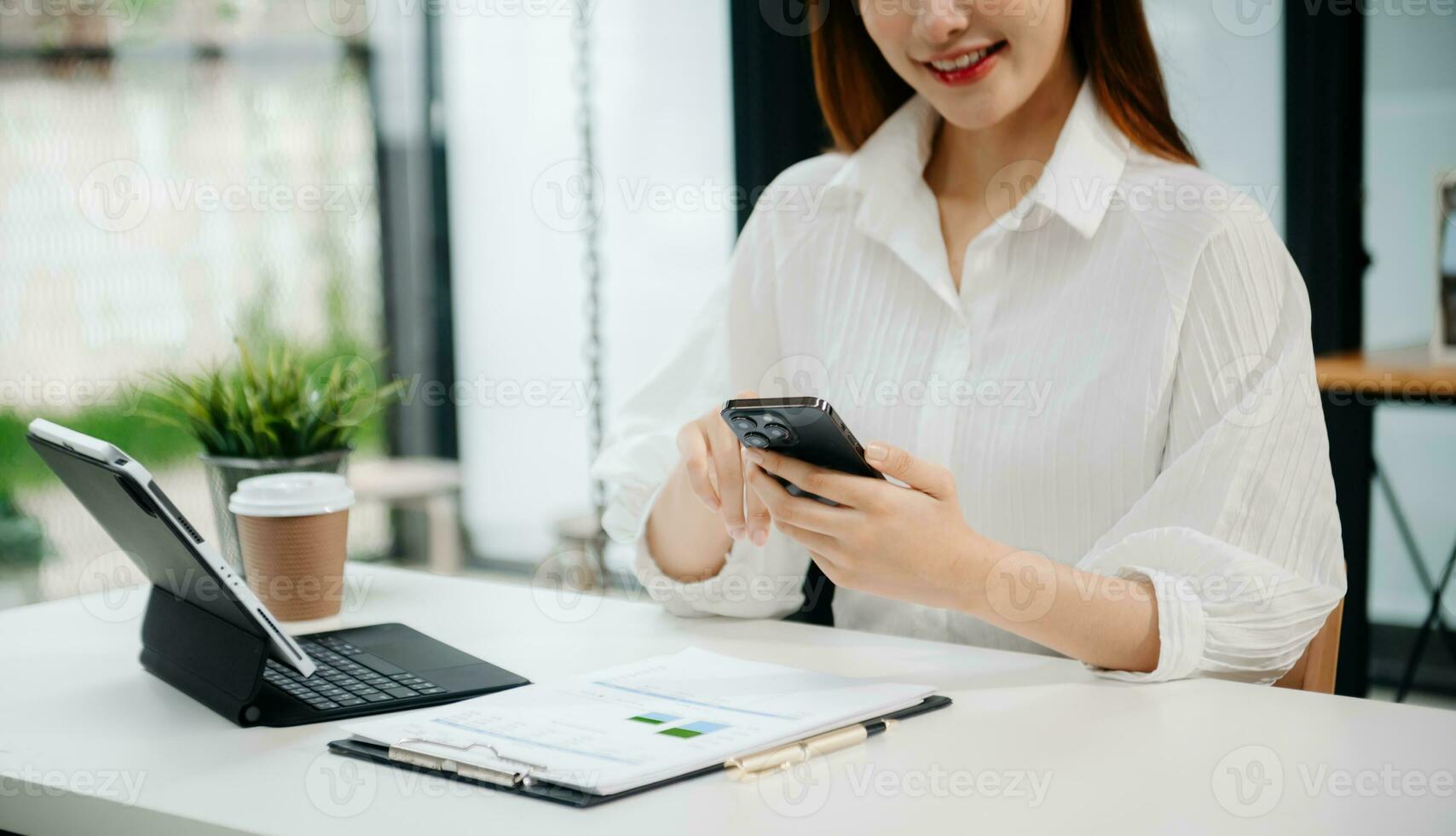 Woman hand using laptop, tablet and smartphone in office. Digital marketing media mobile app and discussing plan new start up project. Finance task. photo