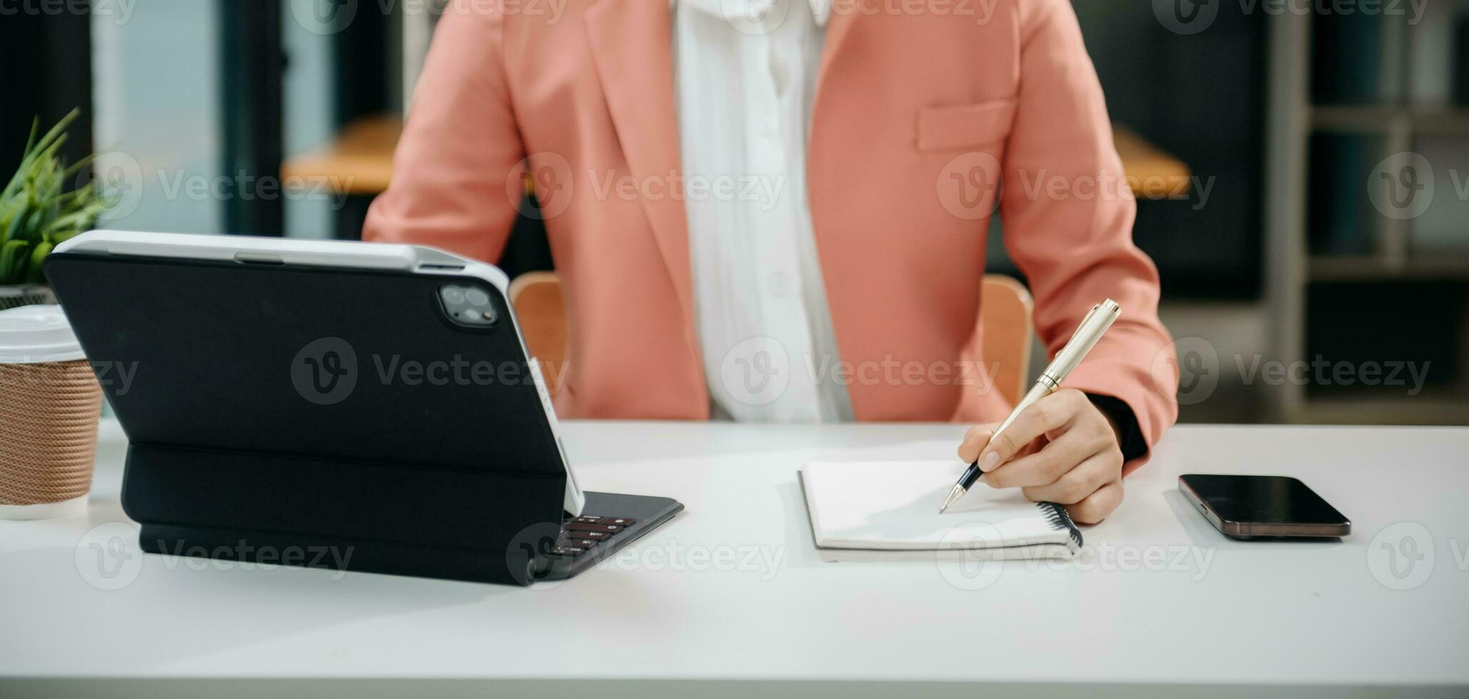 Woman hand using laptop, tablet and smartphone in office. Digital marketing media mobile app and discussing plan new start up project. Finance task. photo