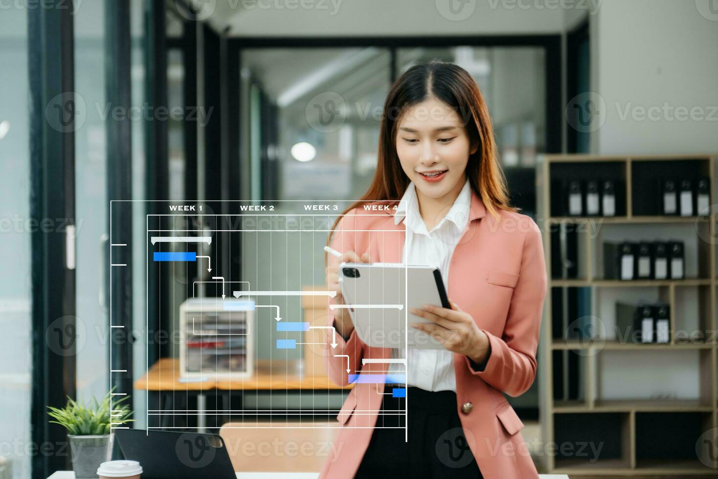 Project manager working and update tasks with milestones progress planning and Gantt chart scheduling diagram. business working with smart phone, tablet and laptop in office. photo