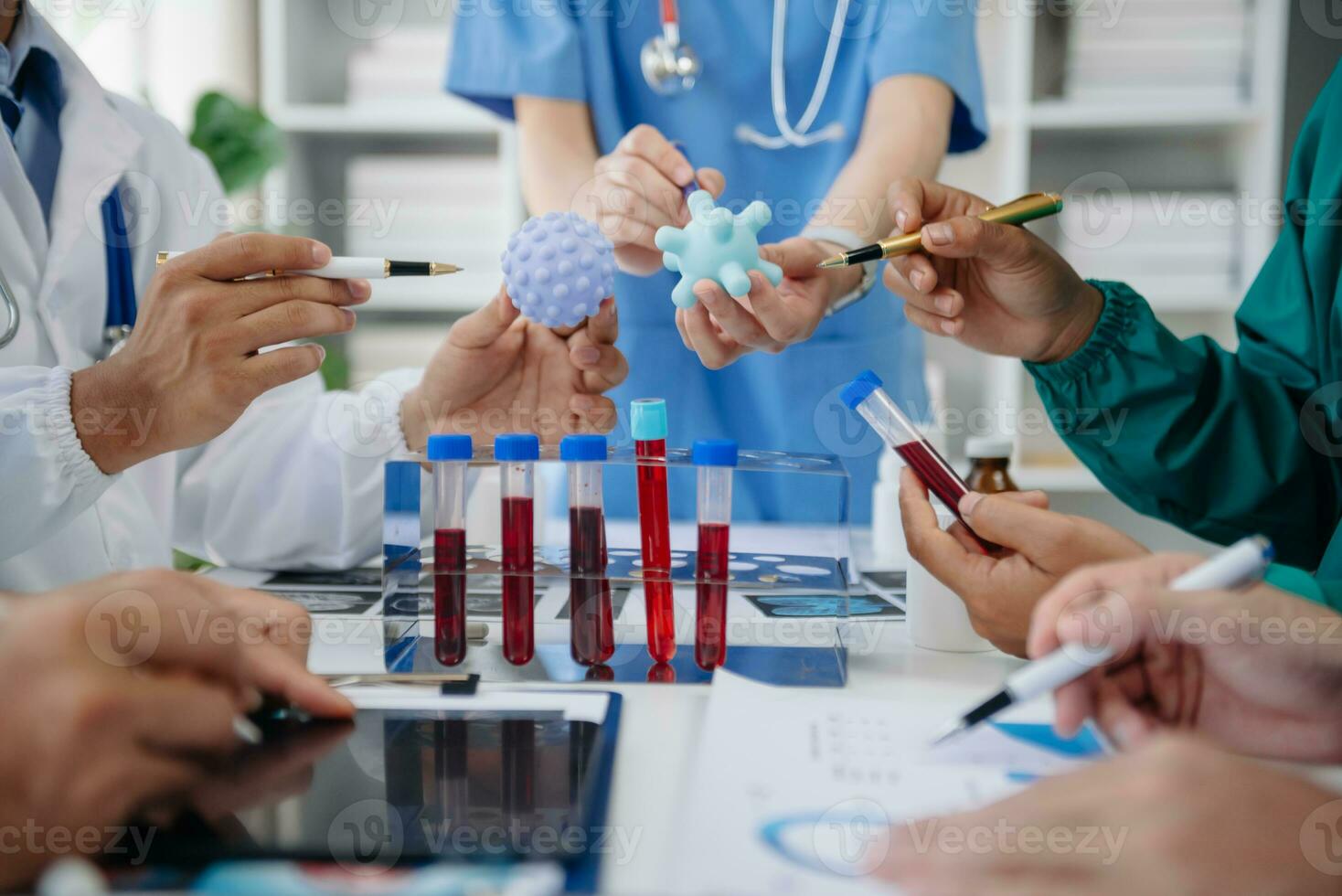 Medical technology network team meeting concept. Doctor hand working with smart phone modern digital tablet and laptop computer with graphics chart interface, with virtual icon diagram photo