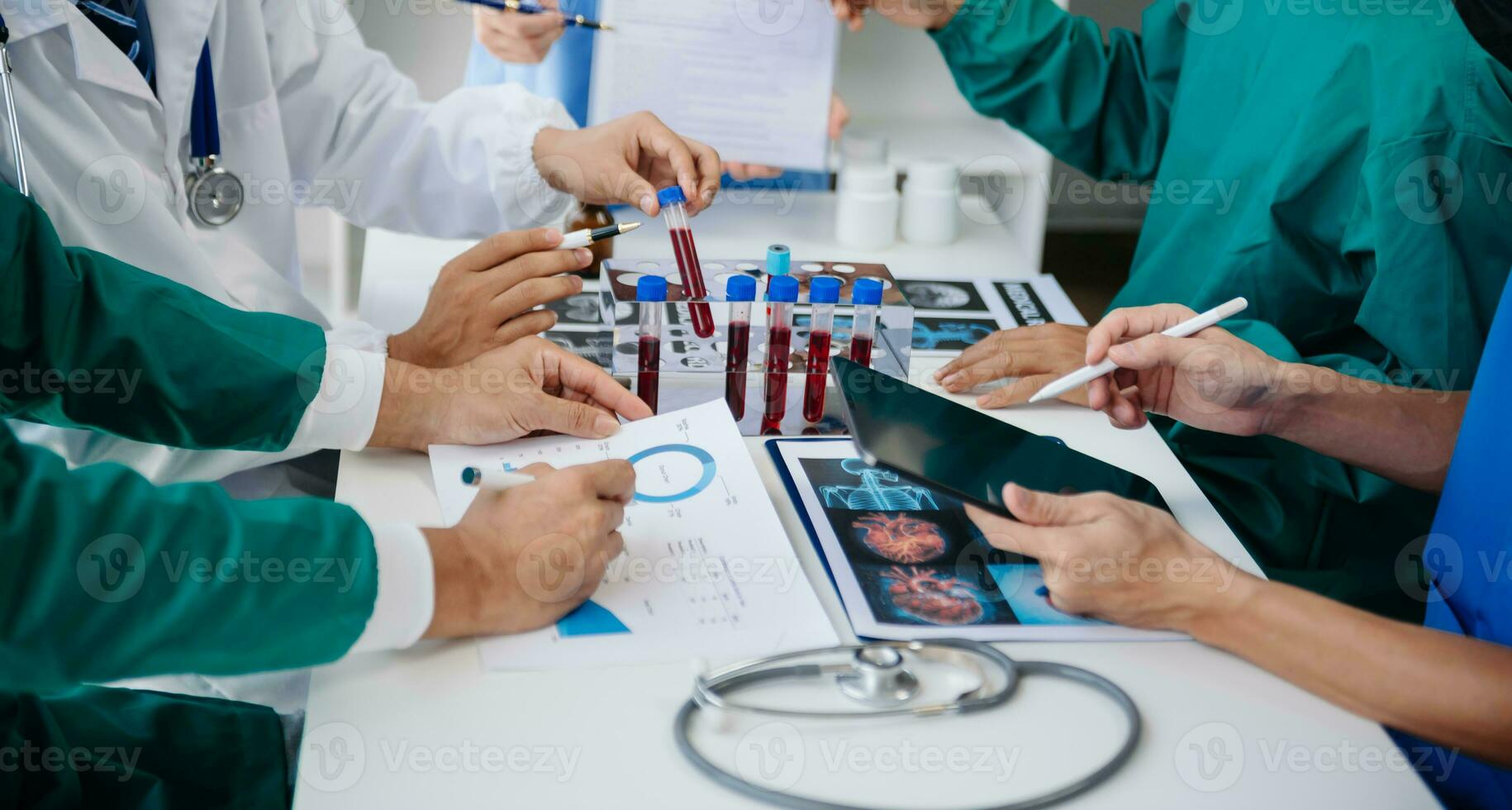 Medical technology network team meeting concept. Doctor hand working with smart phone modern digital tablet and laptop computer with graphics chart interface, with virtual icon diagram photo