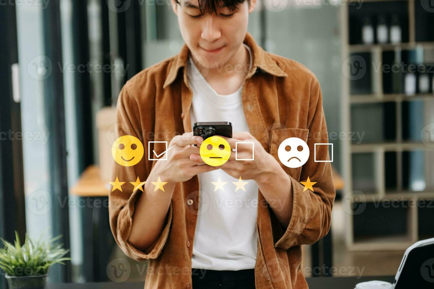 Customer service evaluation concept. Businesswoman pressing face smile emoticon show on virtual screen at tablet and smartphone in office photo