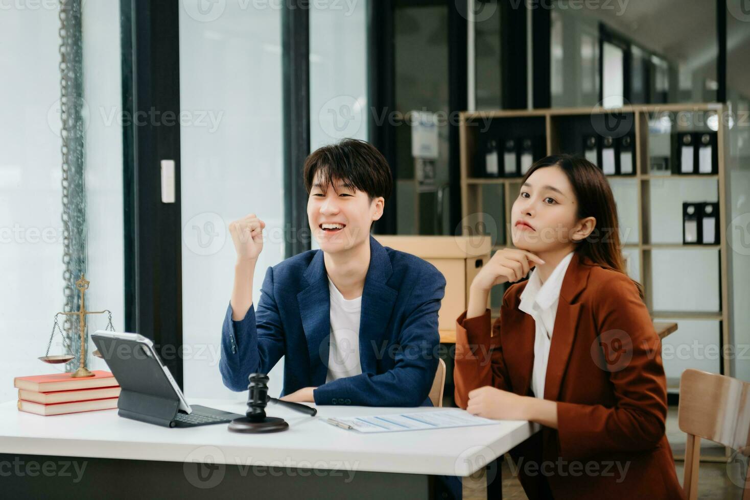 Asian business team and lawyers discussing contract papers sitting at the table. Concepts of law, advice, legal services. at office photo