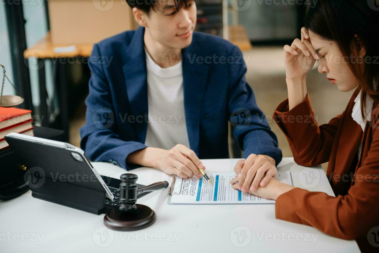 Business law concept, Lawyer business lawyers are consulting lawyers for women entrepreneurs to file copyright lawsuit with laptop and tablet at office photo