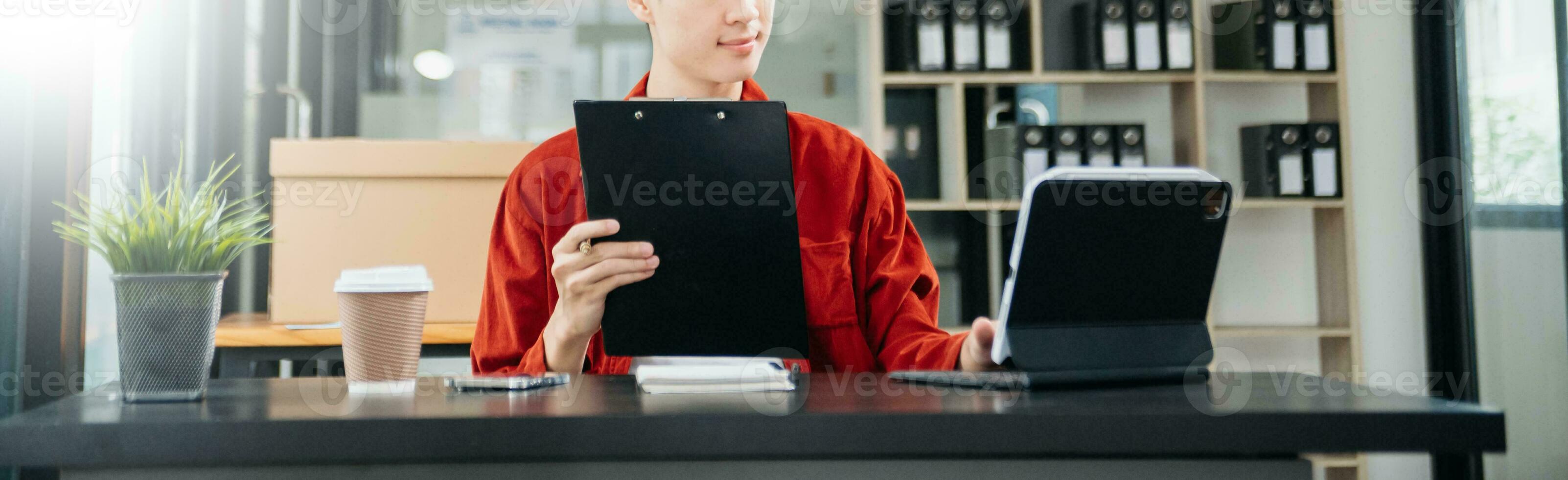 Businessman hand using laptop, tablet and smartphone in office. Digital marketing media mobile app and discussing plan new start up project. Finance task. photo