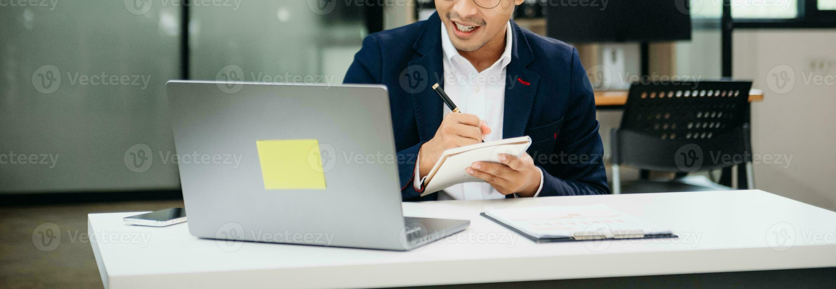 Businessman hand using laptop, tablet and smartphone in office. Digital marketing media mobile app and discussing plan new start up project. Finance task. photo
