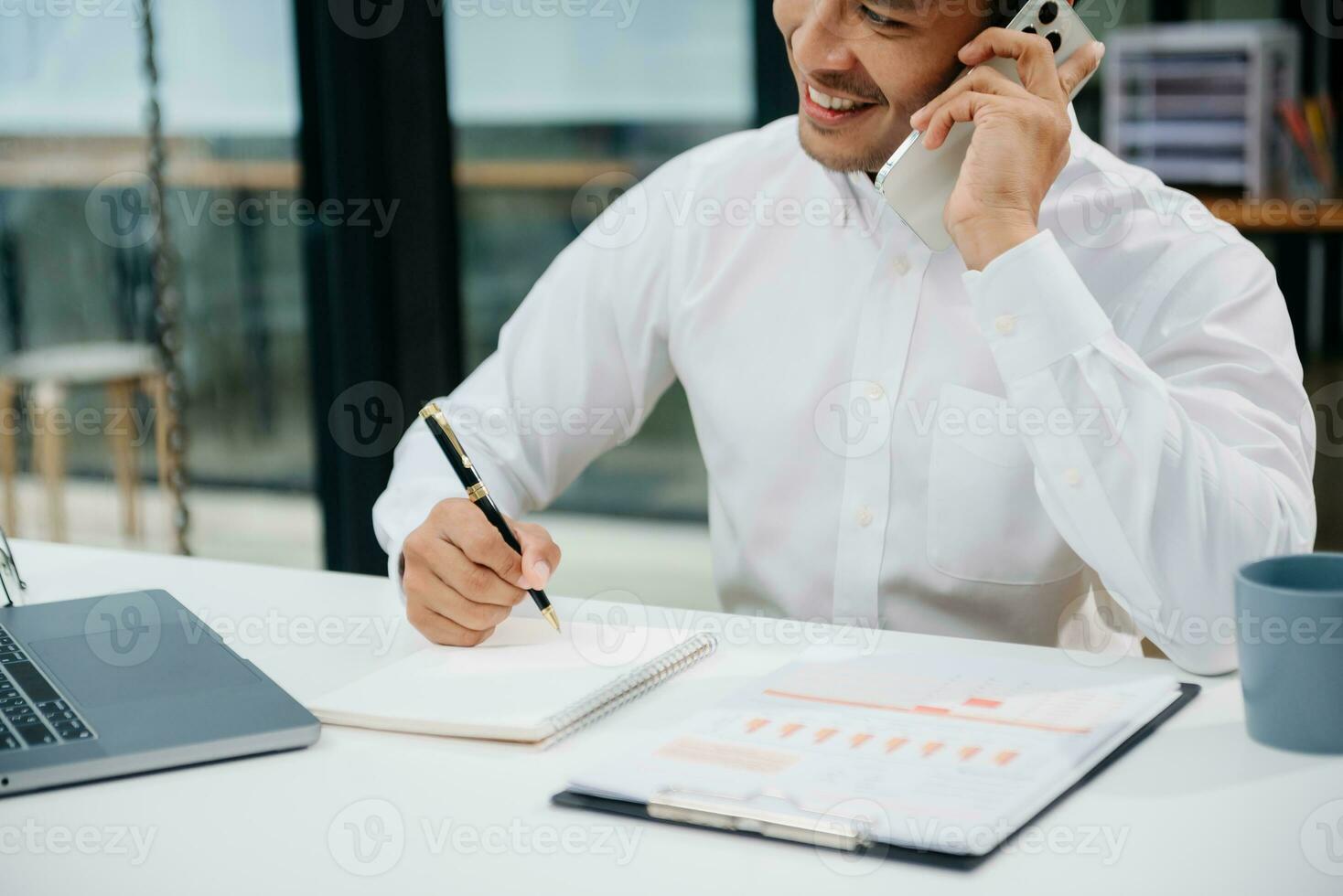 Businessman hand using laptop, tablet and smartphone in office. Digital marketing media mobile app and discussing plan new start up project. Finance task. photo