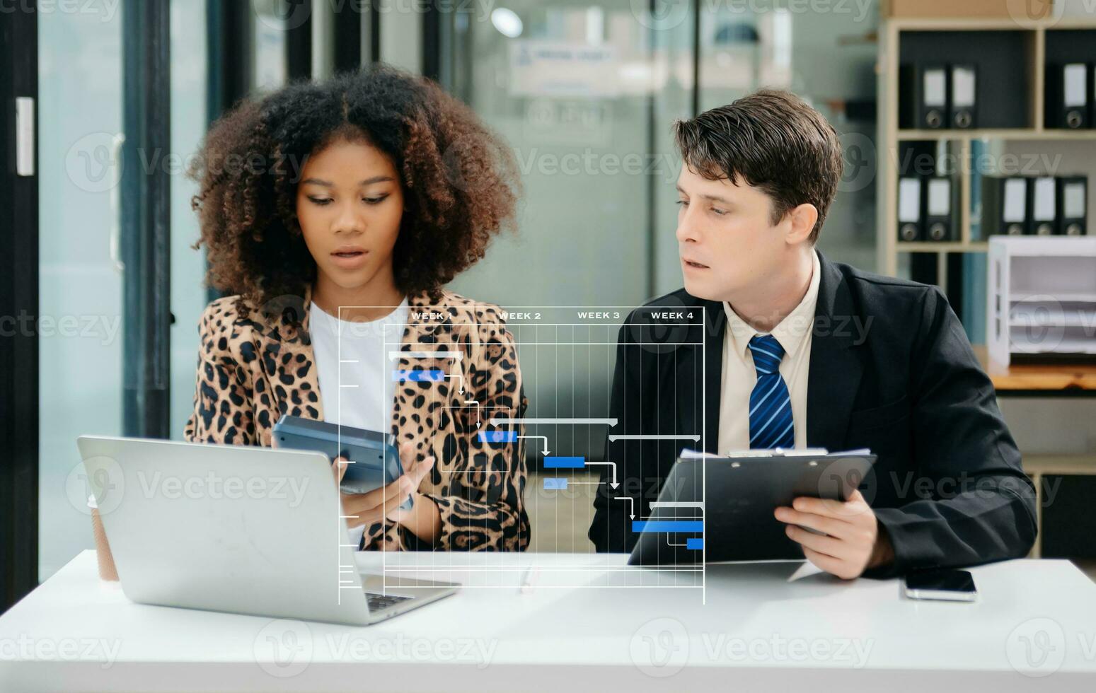 Project manager working and update tasks with milestones progress planning and Gantt chart scheduling diagram. business working with smart phone, tablet and laptop in office. photo