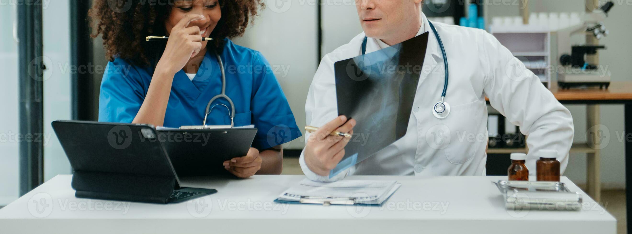 Medical technology network team meeting concept. Doctor hand working with smart phone modern digital tablet and laptop computer photo