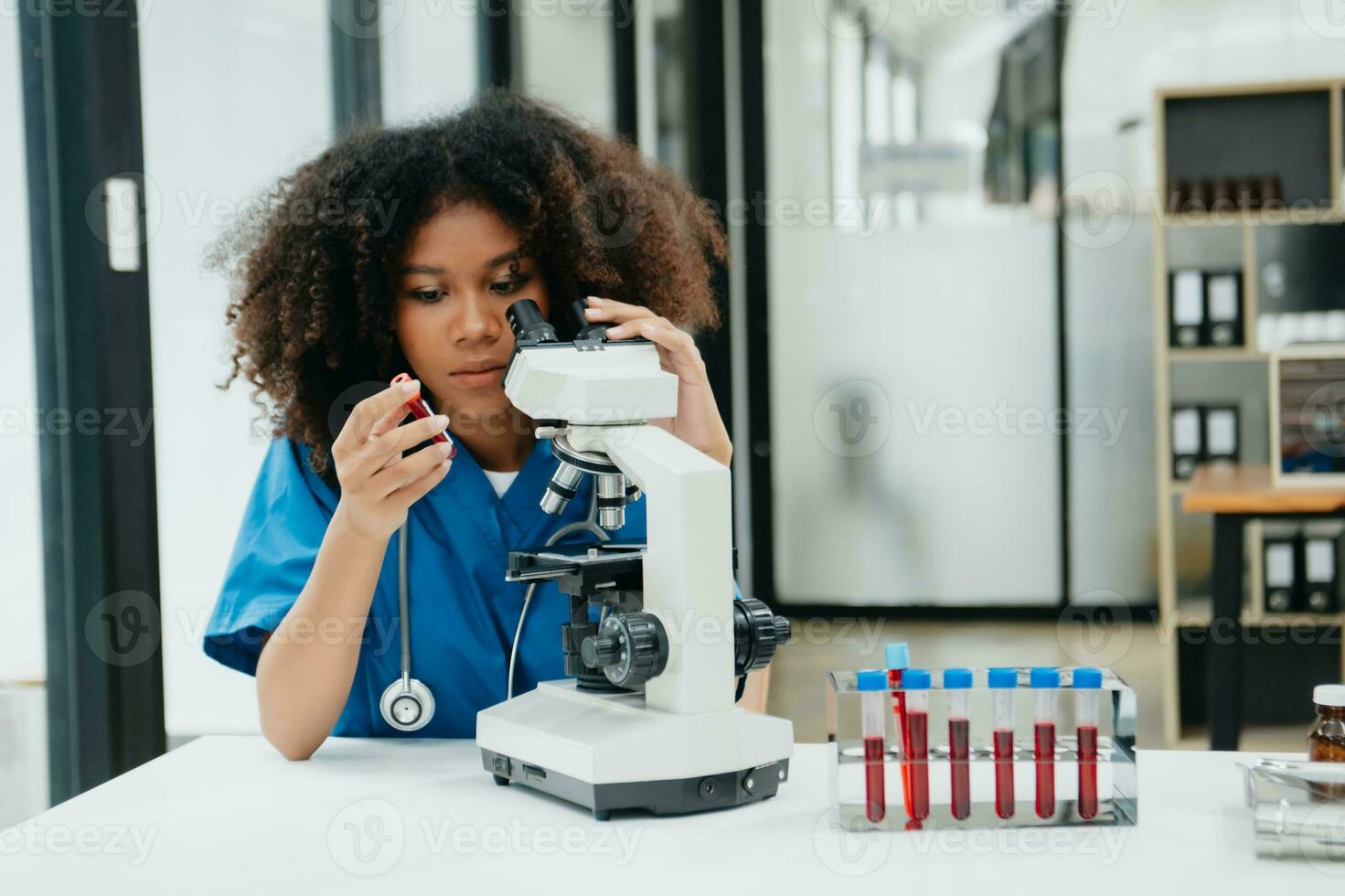 Female biotechnologist testing new chemical substances in a laboratory. photo
