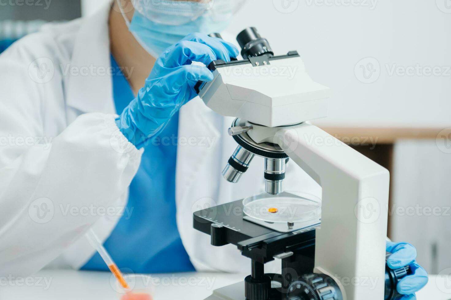 Modern medical research laboratory. female scientist working with micro pipettes analyzing biochemical samples, advanced science chemical laboratory photo