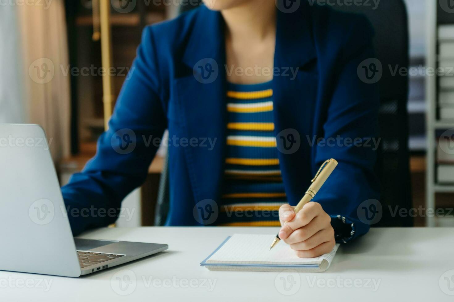 Business woman hand using laptop, tablet and smartphone in office. Digital marketing media mobile app and discussing plan new start up project. photo