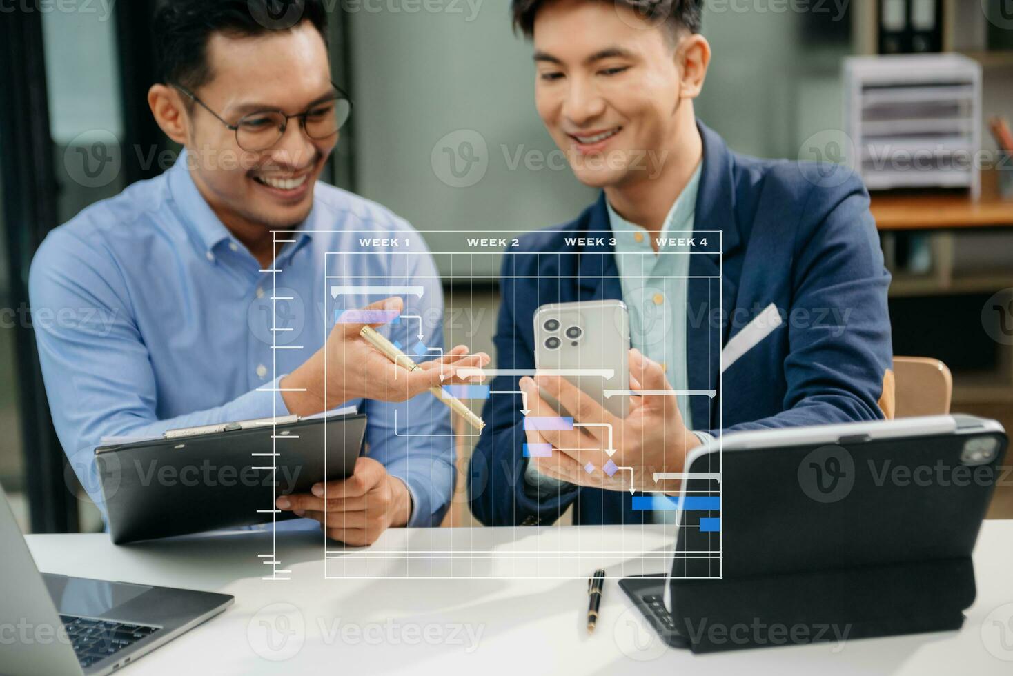 Project manager working and update tasks with milestones progress planning and Gantt chart scheduling diagram. business working with smart phone, tablet and laptop in office. photo