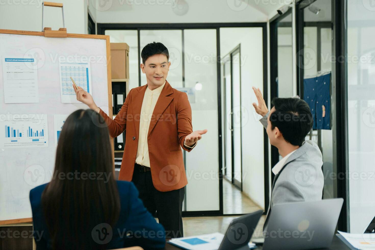 Office colleagues have a casual discussion. During a meeting in a conference room, a group of business teem sit in office room new startup project photo