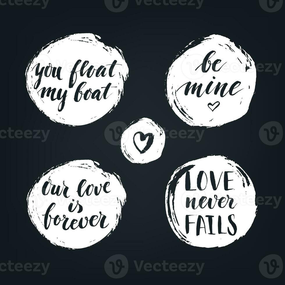 Set of round textured badges with modern calligraphy love quotes on the blackboard. photo