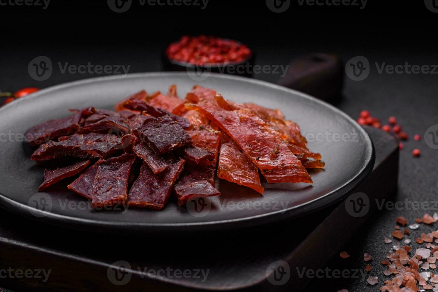Delicious dried veal or turkey jerky with salt, spices and herbs photo