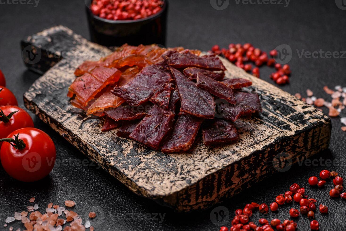 Delicious dried veal or turkey jerky with salt, spices and herbs photo