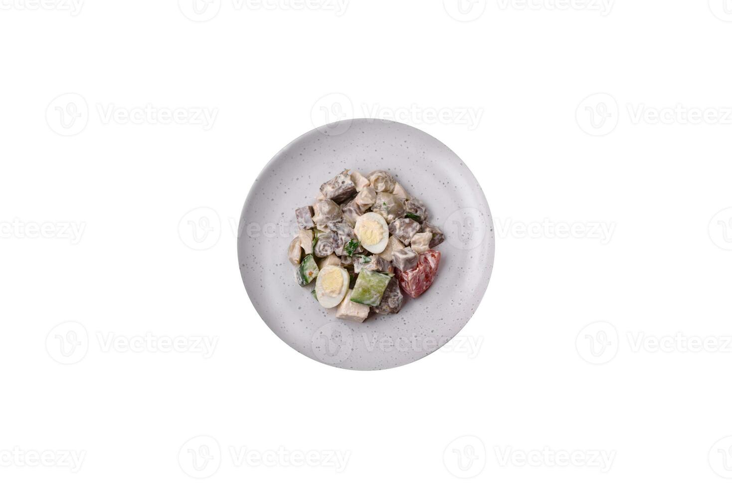 Delicious salad with boiled beef tongue, quail eggs, tomatoes and cucumber photo