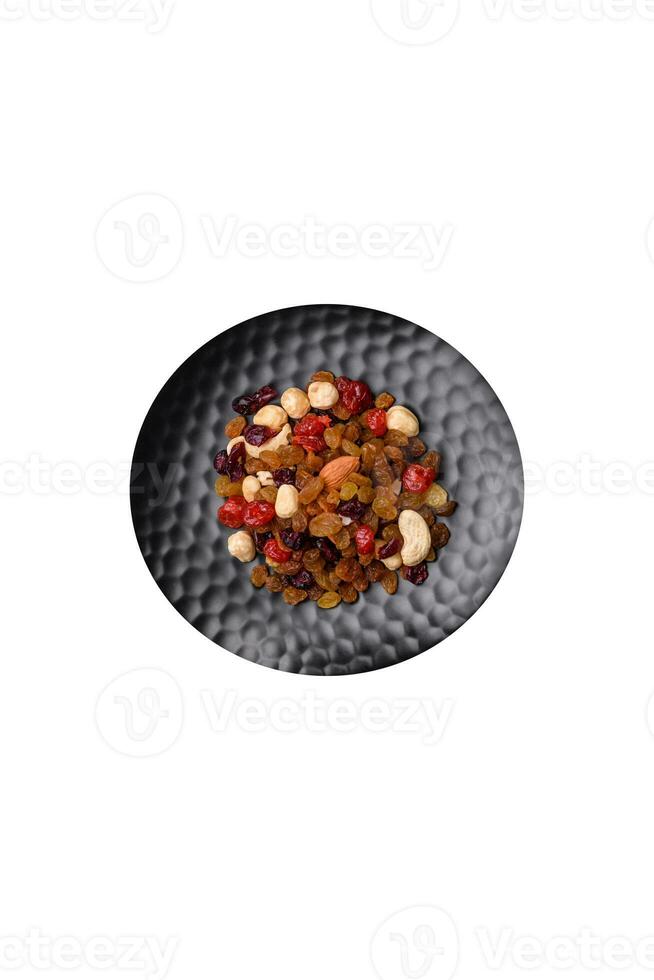 Roasted pecans and macadamia nuts, dried tangerine, dried berries photo