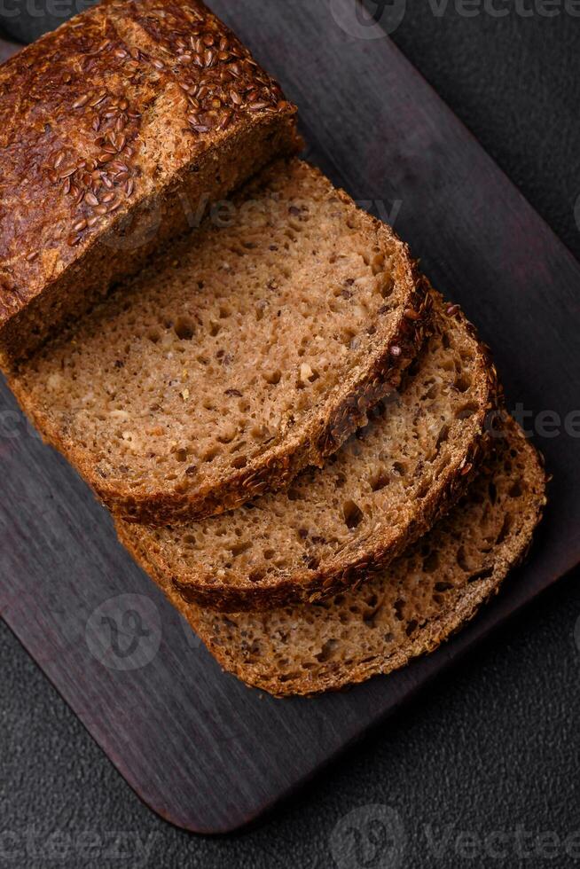 Delicious fresh crispy brown bread with grains and seeds photo