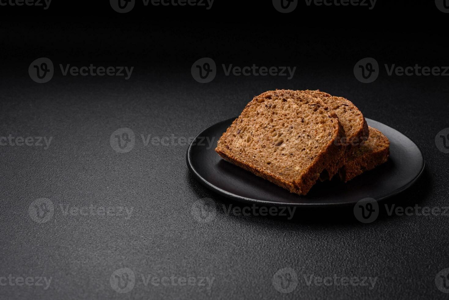 Delicious fresh crispy brown bread with grains and seeds photo