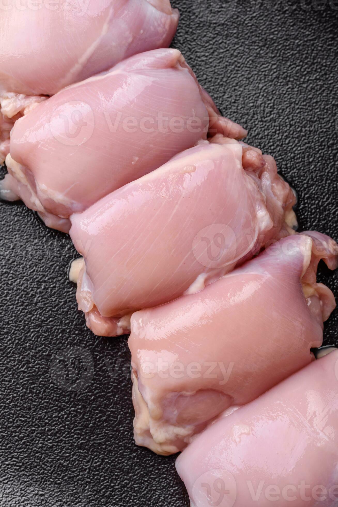 fresh-raw-chicken-thigh-fillets-with-salt-spices-and-herbs-29379321