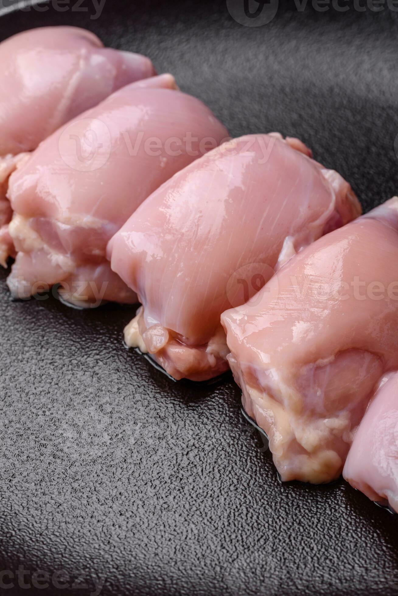 fresh-raw-chicken-thigh-fillets-with-salt-spices-and-herbs-29379327