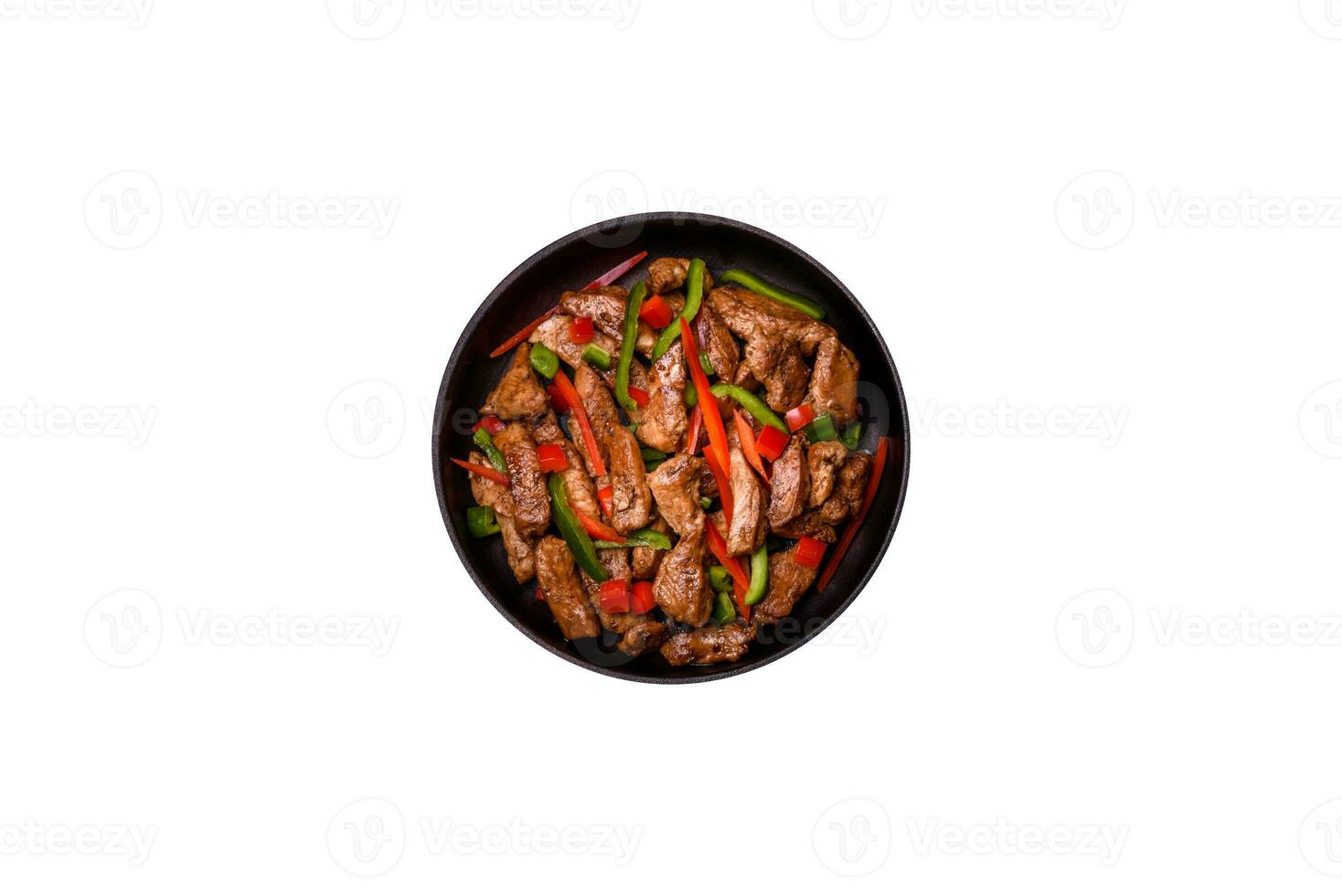 Delicious Asian teriyaki meat with red and green bell peppers photo