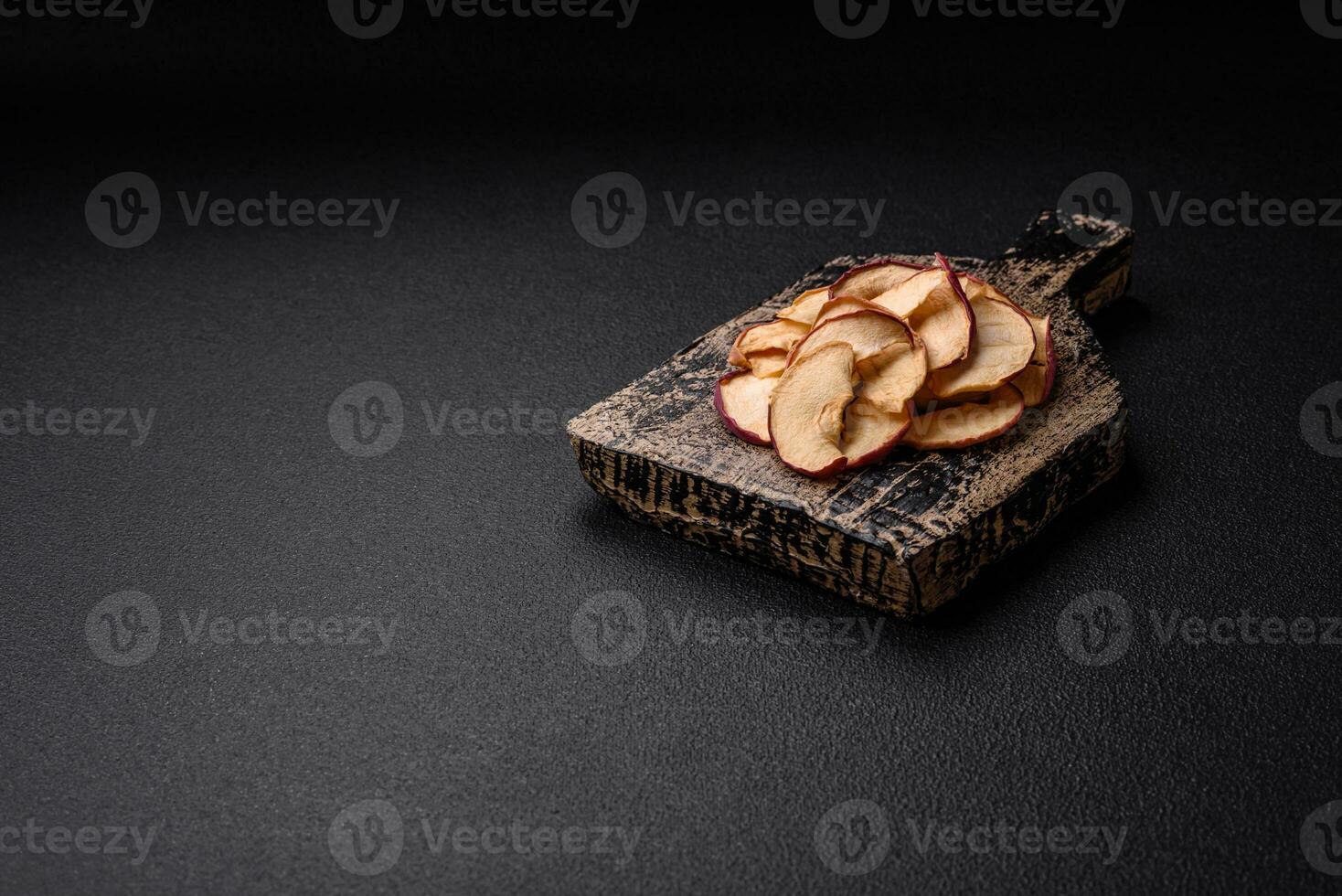 Delicious ripe red apple, sliced and dried in a special dryer photo