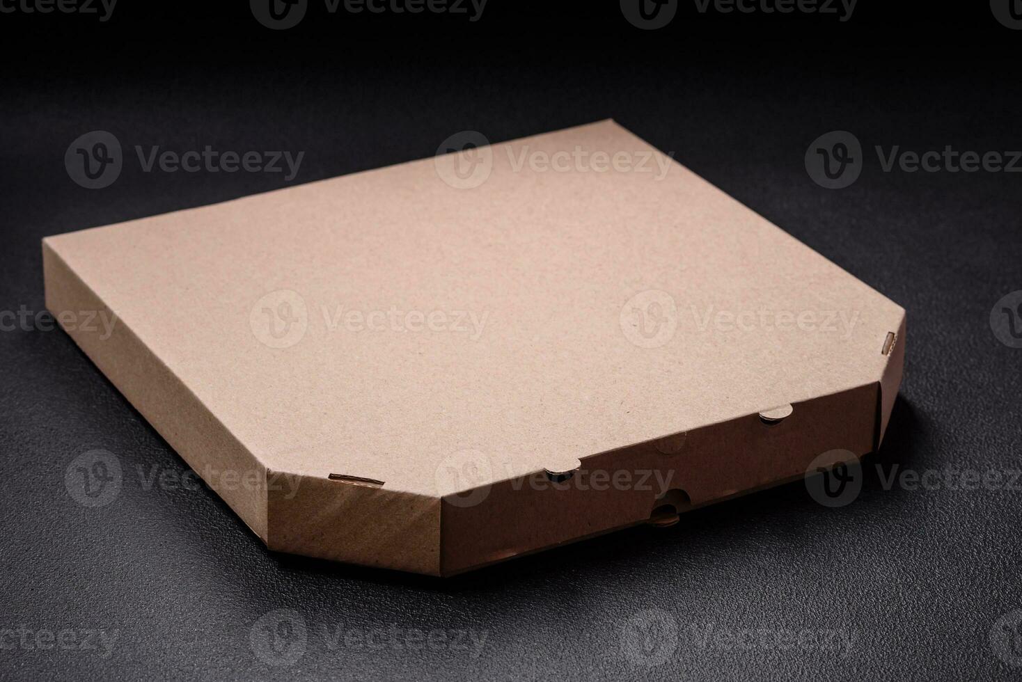 vacío cartulina rectangular marrón caja para entrega de delicioso Pizza foto