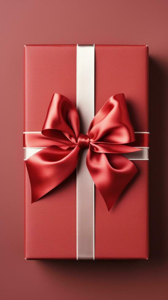 Red gift box with a ribbon and bow photo