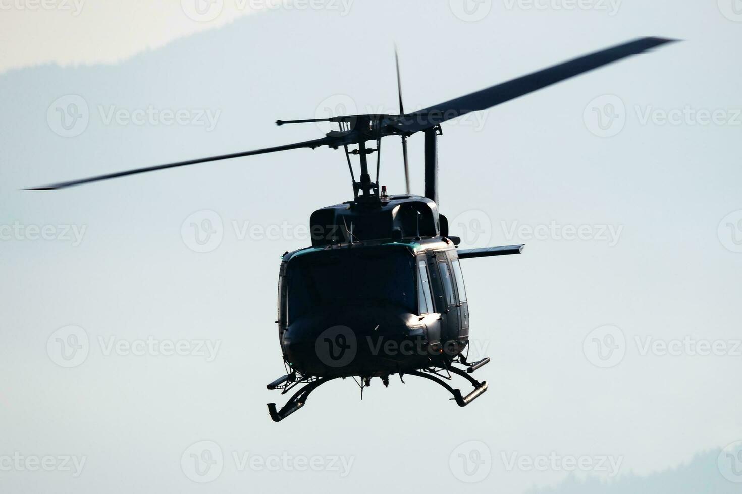Untitled military helicopter at air base. Air force and army flight transportation. Aviation and rotorcraft. Transport and airlift. Military industry. Fly and flying. photo