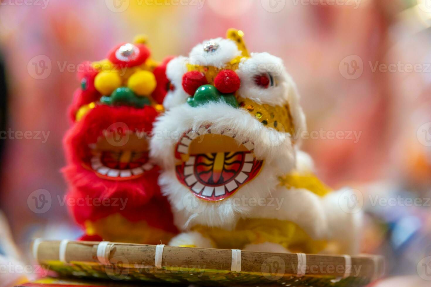Decorated colorful lanterns hanging on a stand in the streets in Ho Chi Minh City, Vietnam during Mid Autumn Festival. Chinese language in photos mean money and happiness. Selective focus.