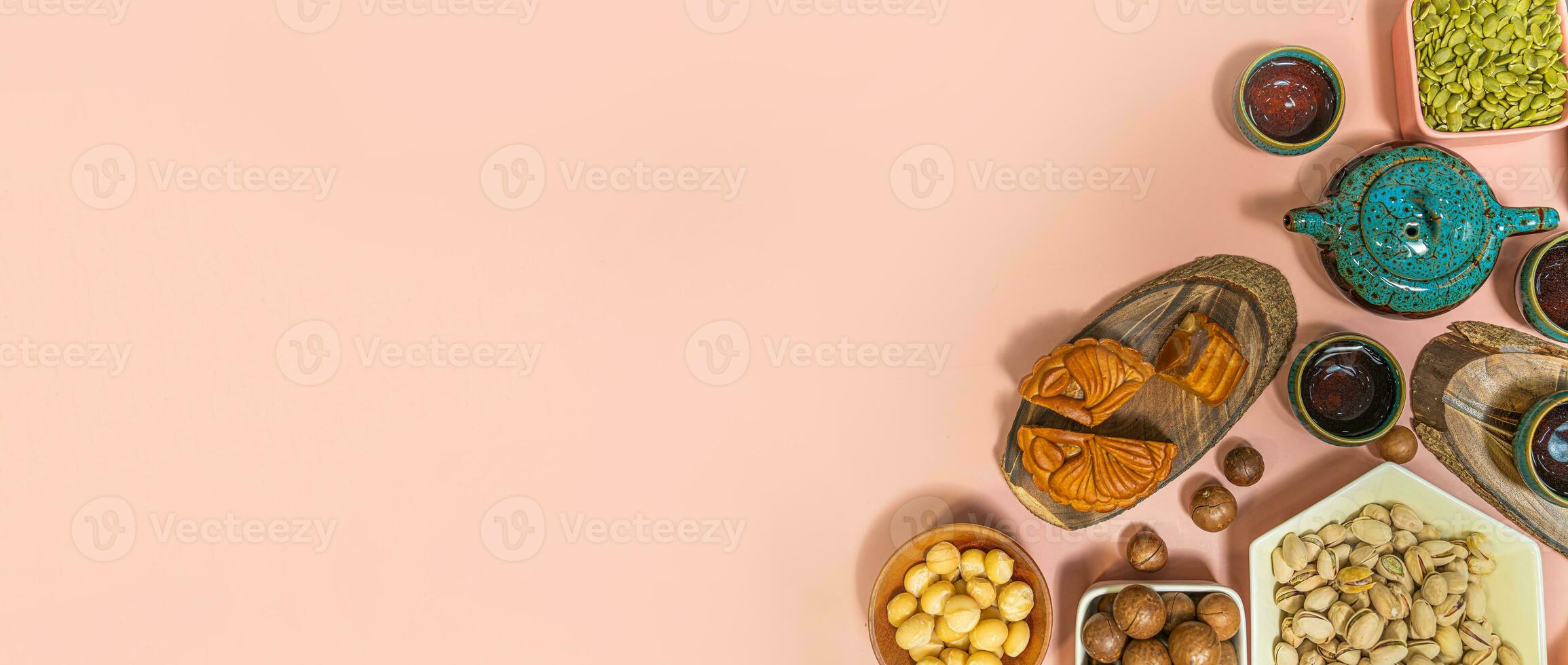 a tasty round moon cakes at mid autumn festival. Flat lay mid autumn festival food and drink on sweet pink background. photo