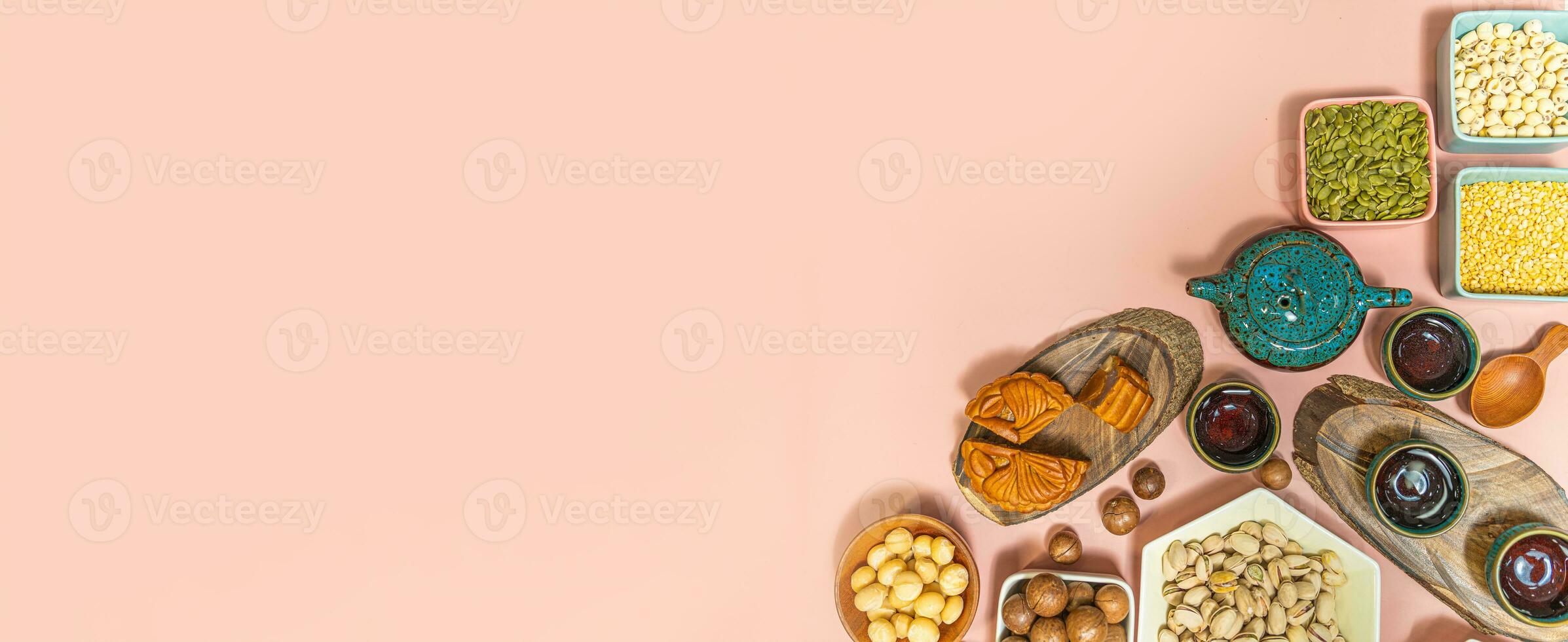 a tasty round moon cakes at mid autumn festival. Flat lay mid autumn festival food and drink on sweet pink background. photo