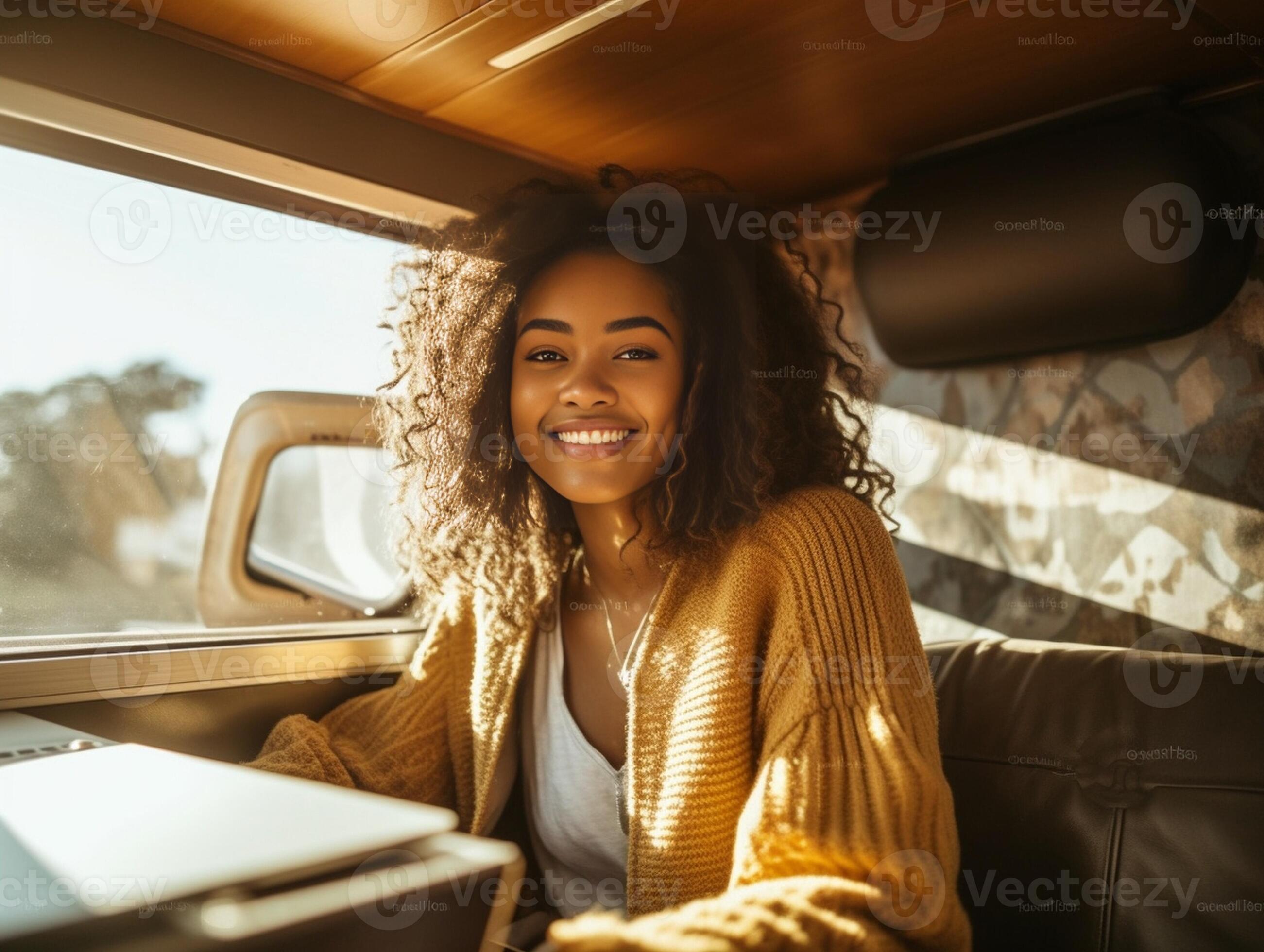 Enjoying the travel Attractive young woman looking out the vans window