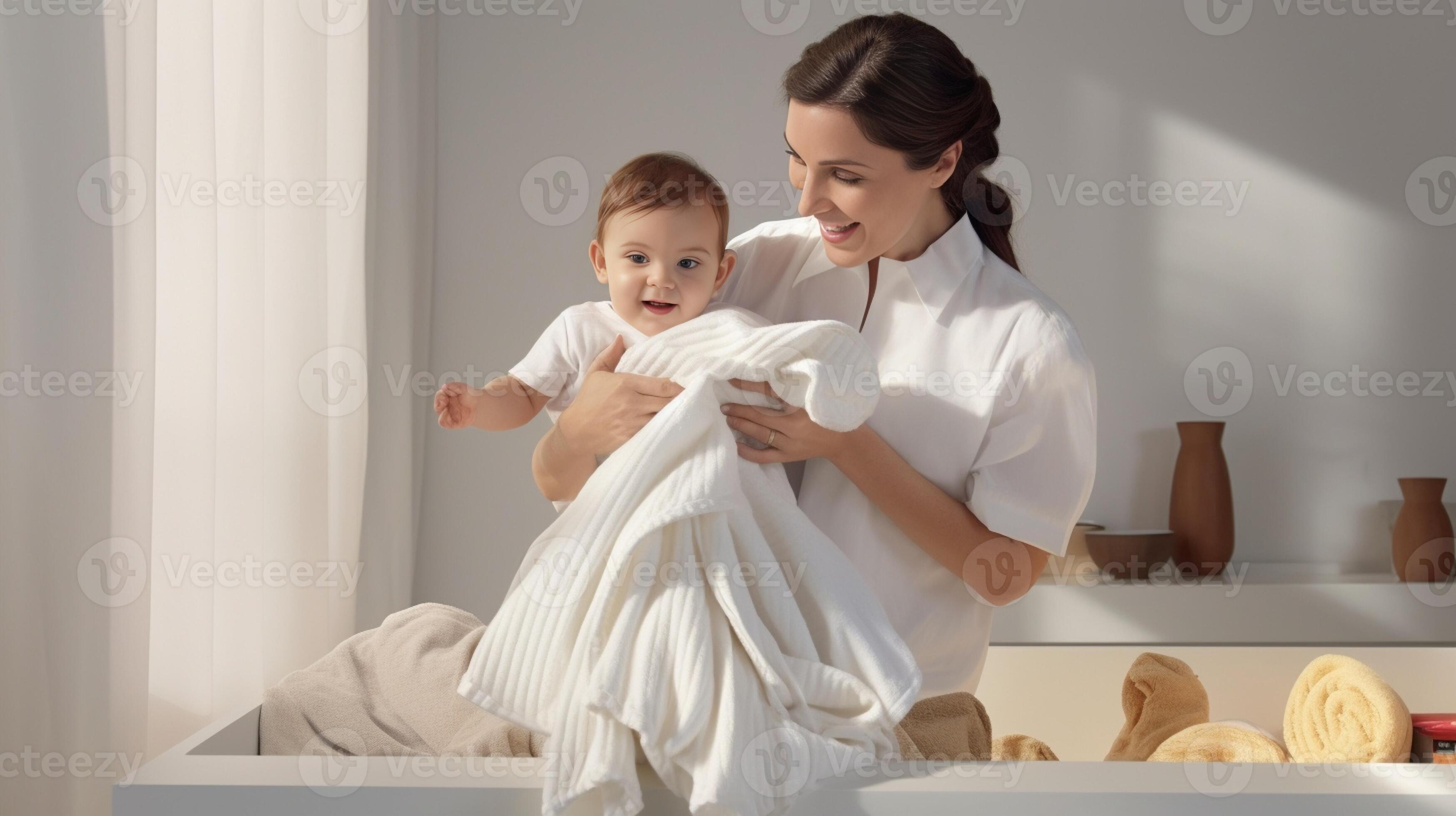 Time to start new day Closeup part of little baby girl sitting on bed with her mother and