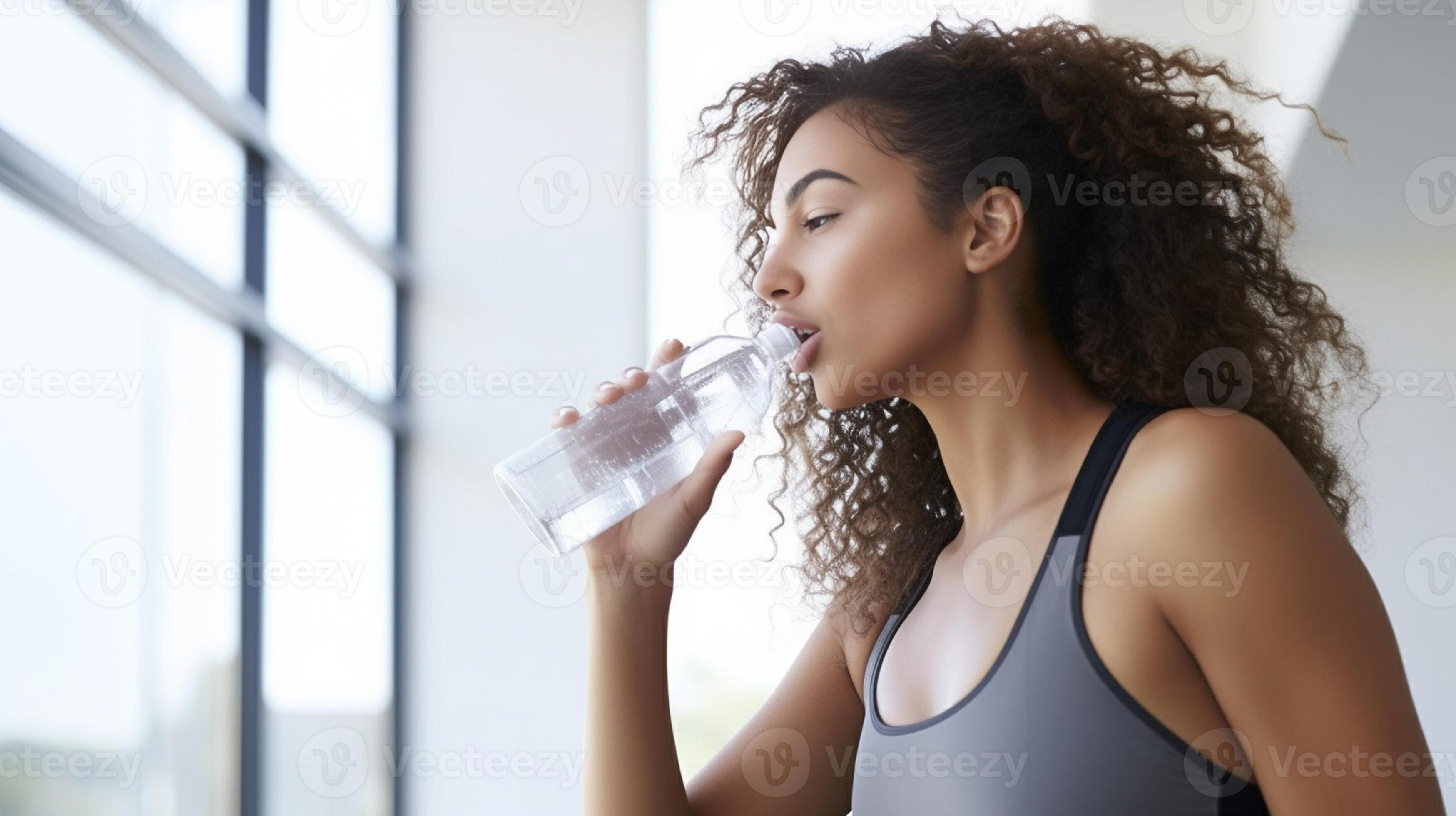 african woman drinking water