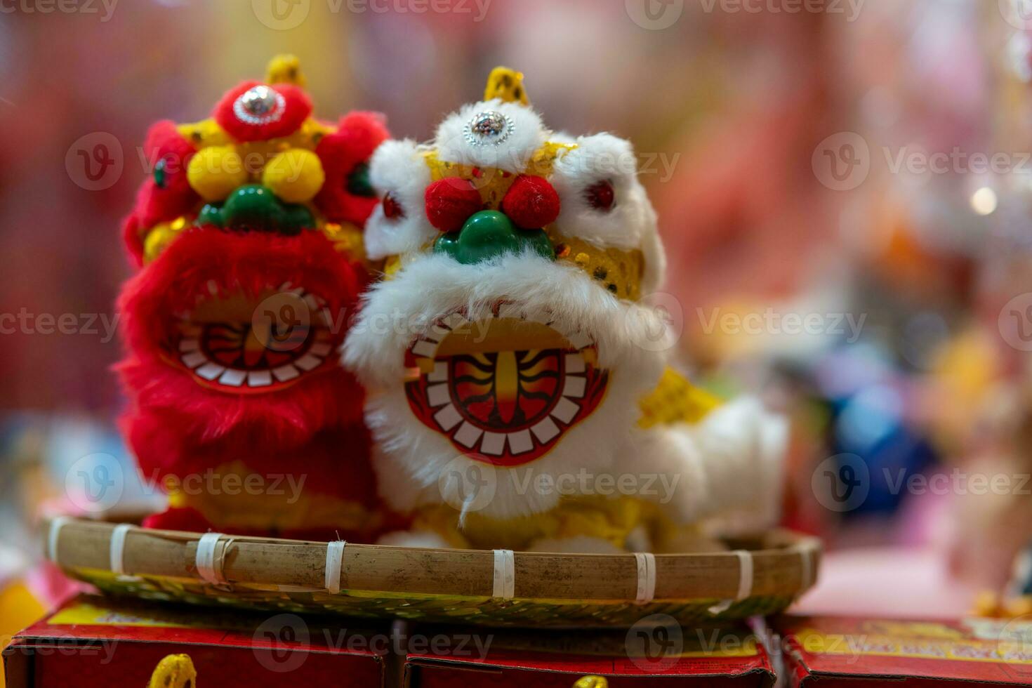 Decorated colorful lanterns hanging on a stand in the streets in Ho Chi Minh City, Vietnam during Mid Autumn Festival. Chinese language in photos mean money and happiness. Selective focus.