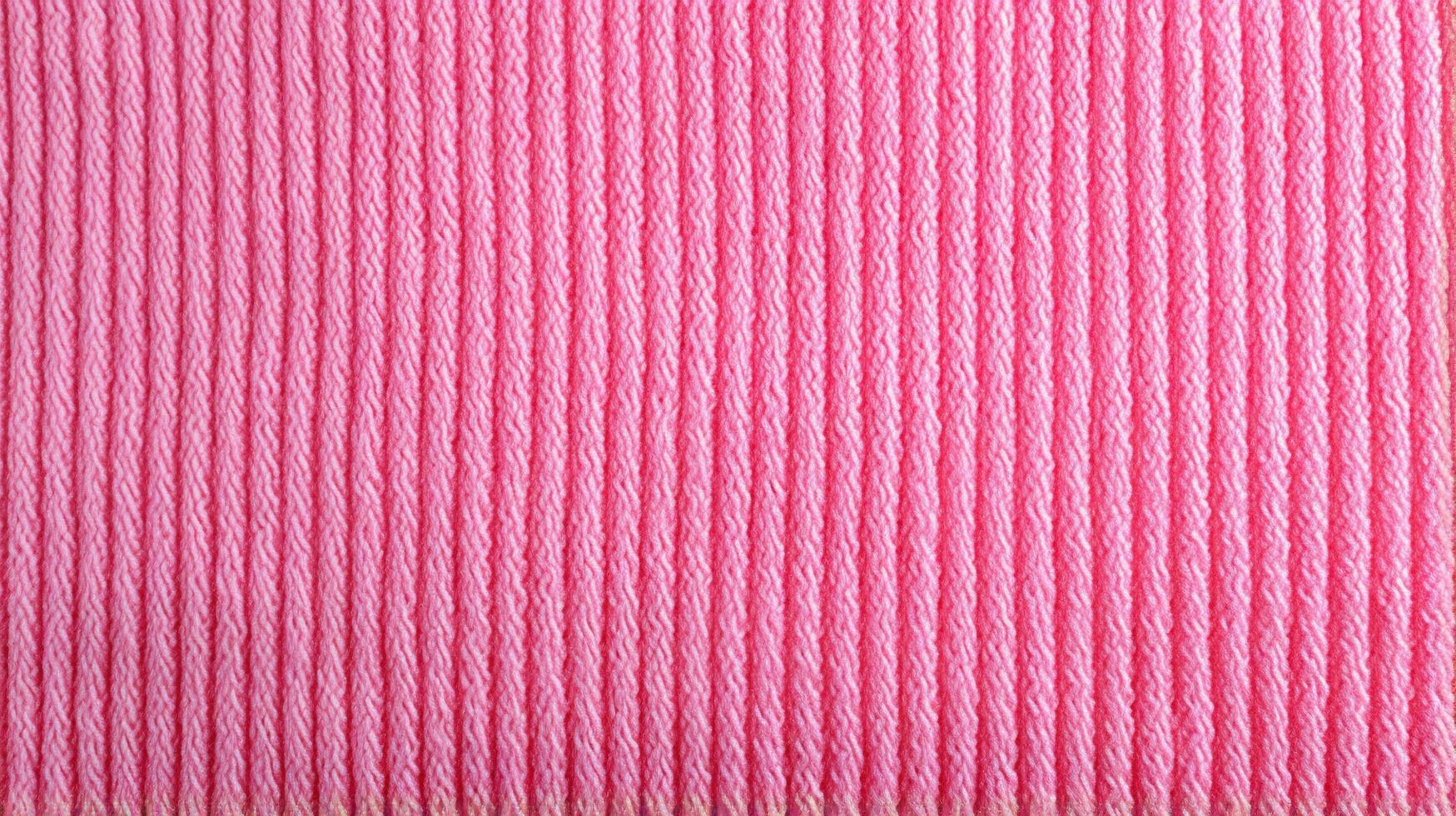 Generative AI, knitted pink sweater texture closeup, magenta or light pink abstract background photo