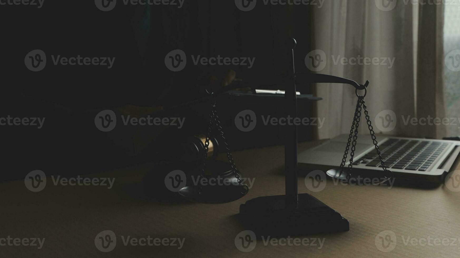 Business and lawyers discussing contract papers with brass scale on desk in office. Law, legal services, advice, justice and law concept picture with film grain effect photo