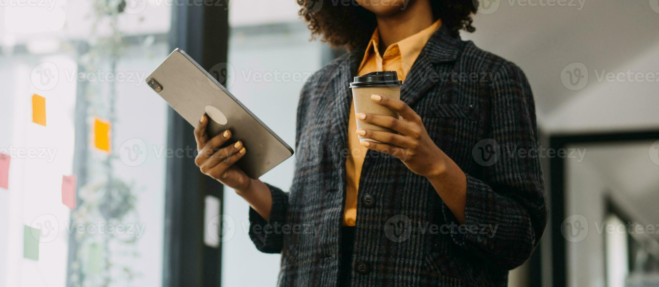 Entrepreneur Asian businessman and businesswoman discussing new business project in tablet in modern Meeting In Modern Office, Asian business casual concept. photo