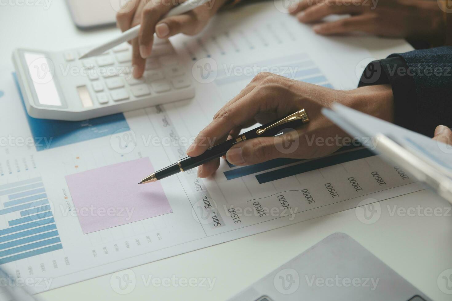 Accounting businessman working on laptop computer and analyzing real estate investment data, Financial and tax systems concept. photo