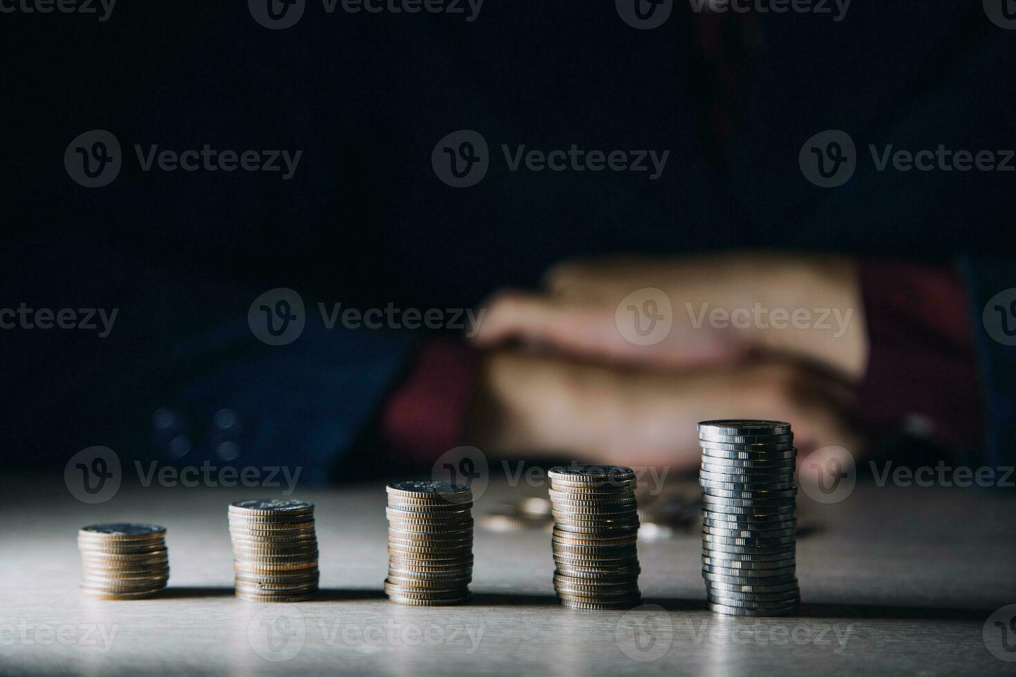 Money, Financial, Business Growth concept, Man's hand put money coins to stack of coins photo