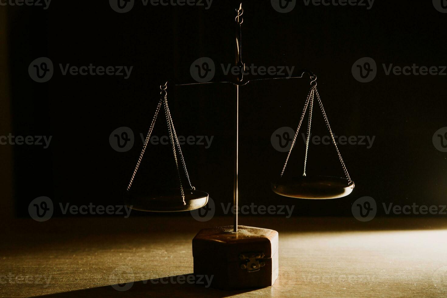 Business and lawyers discussing contract papers with brass scale on desk in office. Law, legal services, advice, justice and law concept picture with film grain effect photo