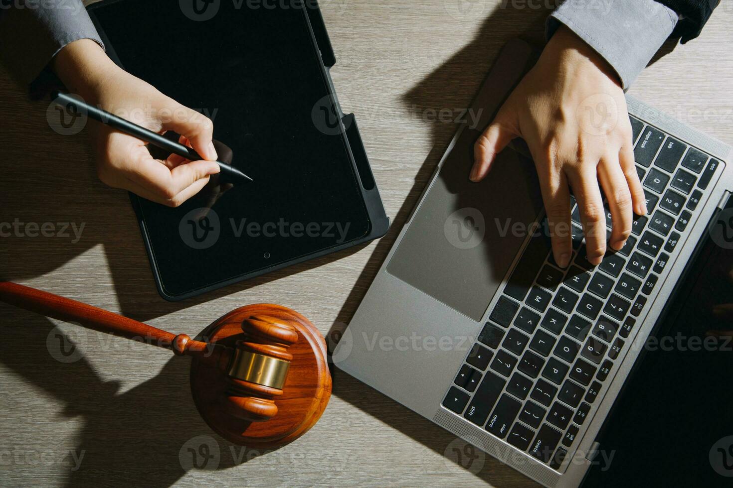 Business and lawyers discussing contract papers with brass scale on desk in office. Law, legal services, advice, justice and law concept picture with film grain effect photo